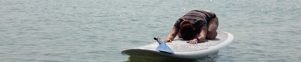 SUP Yoga on Higgins Lake. Class is every Sunday at 10:00am until August 24th!